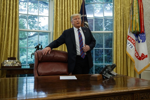 President Donald Trump arrives for a phone call with Mexican President Enrique Pena Nieto in the Oval Office of the White House, Monday, Aug. 27, 2018, in Washington. Trump is announcing a trade &quot ...
