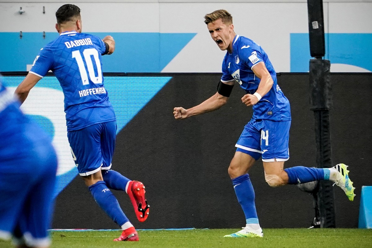 epa08448196 Hoffenheim's Christoph Baumgartner (R) celebrates after scoring the 1-0 lead during the German Bundesliga soccer match between TSG 1899 Hoffenheim and 1. FC Koeln at PreZero Arena in  ...