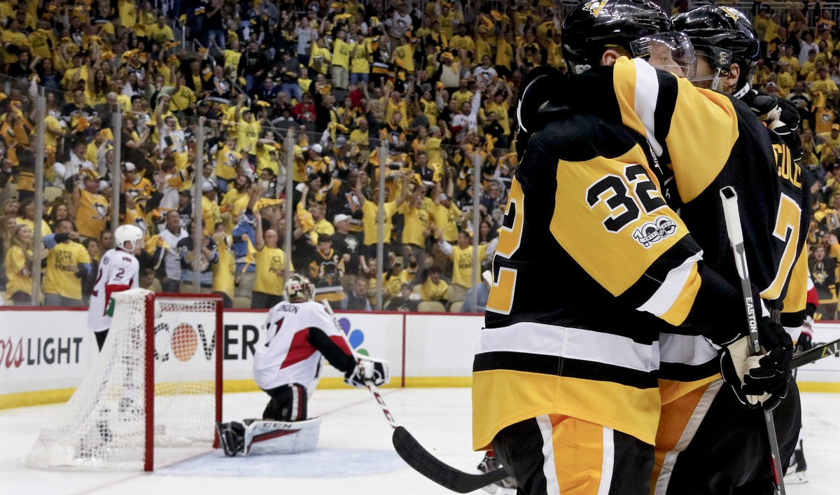 Pittsburgh Penguins' Matt Cullen (7) celebrates with Mark Streit (32) after scoring on Ottawa Senators goalie Craig Anderson (41) during the second period of Game 5 in the NHL hockey Stanley Cup  ...