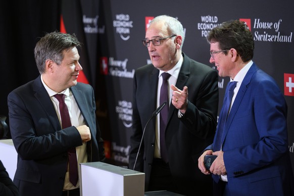 Germany&#039;s Robert Habeck, left, vice-chancellor and Federal minister for economy and climate action speaks with Switzerland&#039;s Economy Minister Guy Parmelin, center, and Switzerland&#039;s Tra ...