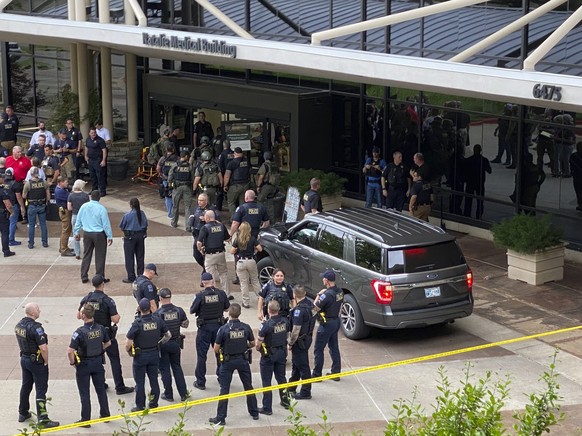 Emergency personnel respond to a shooting at the Natalie Medical Building Wednesday, June 1, 2022. in Tulsa, Okla. Multiple people were shot at a Tulsa medical building on a hospital campus Wednesday. ...