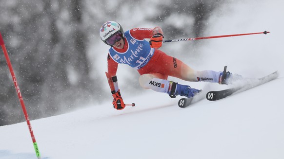 Switzerland's Michelle Gisin speeds down the course during an alpine ski, women's World Cup giant slalom, in Kronplatz, Italy, Tuesday, Jan. 24, 2023. (AP Photo/Alessandro Trovati)