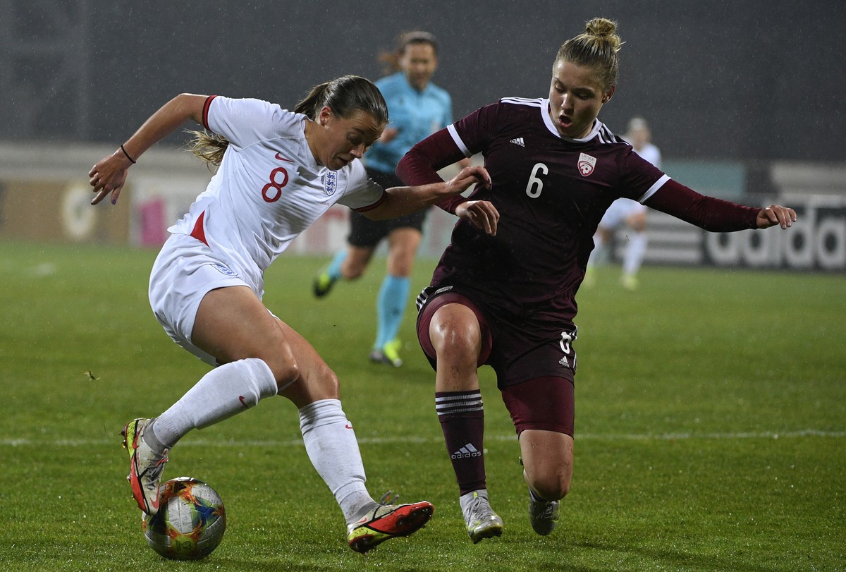 Latvia's Arta Lubina, right, fights for the ball with England's Franceska Kirby during the 2023 Women's World Cup Qualifying match between Latvia and England at the Daugava stadium in R ...