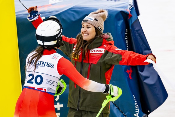 Eliane Christen of Switzerland and Priska Ming-Nufer of Switzerland react in the finish area during the Slalom race of the Women's Team Combined at the 2025 FIS Alpine World Ski Championships, in ...