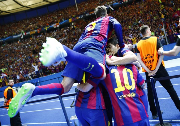 Football - FC Barcelona v Juventus - UEFA Champions League Final - Olympiastadion, Berlin, Germany - 6/6/15
Luis Suarez celebrates with Gerard Pique and team mates after scoring the second goal for B ...