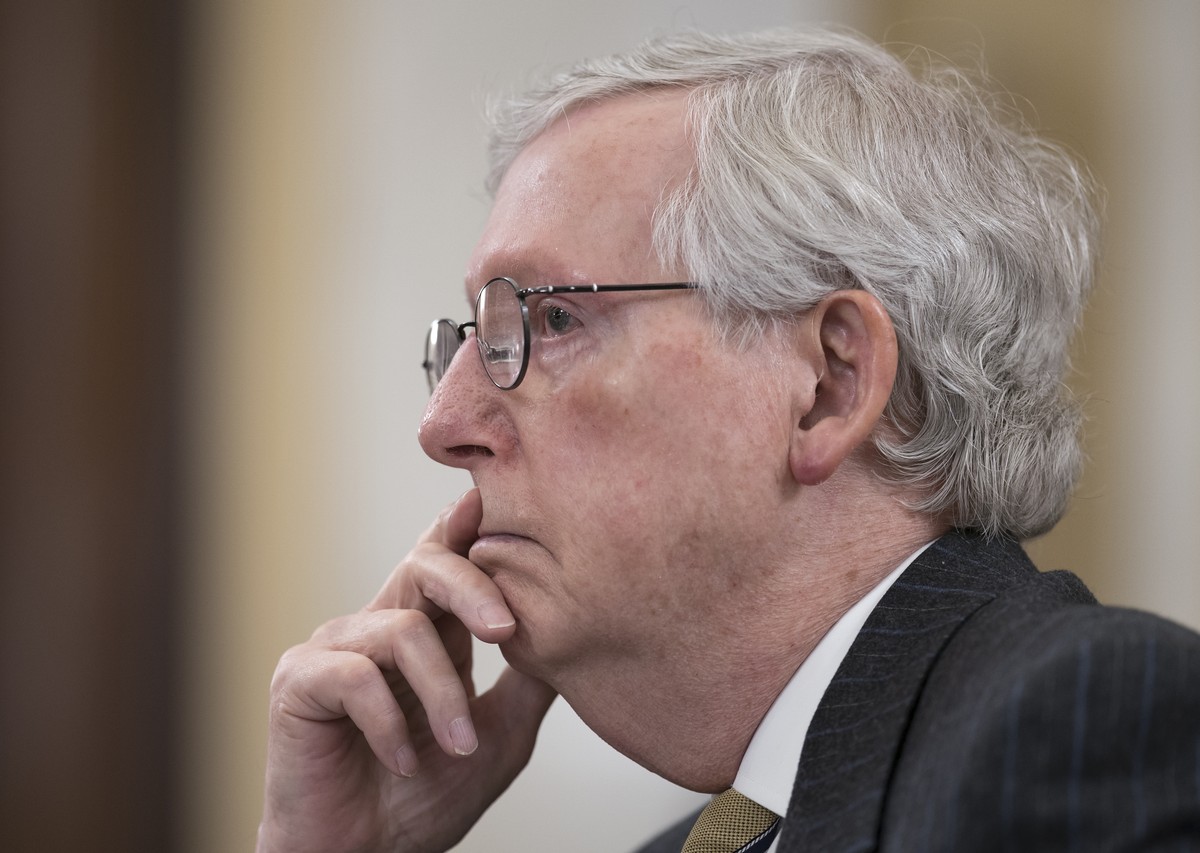 FILE - In this March 24, 2021, file photo Senate Minority Leader Mitch McConnell, R-Ky., listens as the Senate Rules Committee holds a hearing on the "For the People Act," which would expand ...