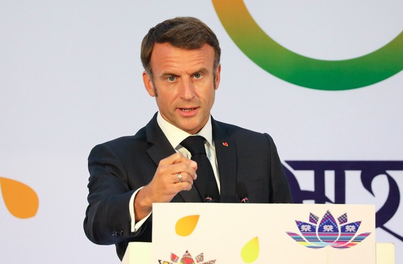 epa10852378 French President Emmanuel Macron addresses a press conference at the international media center during the G20 Summit in New Delhi, India, 10 September 2023. The G20 Heads of State and Gov ...