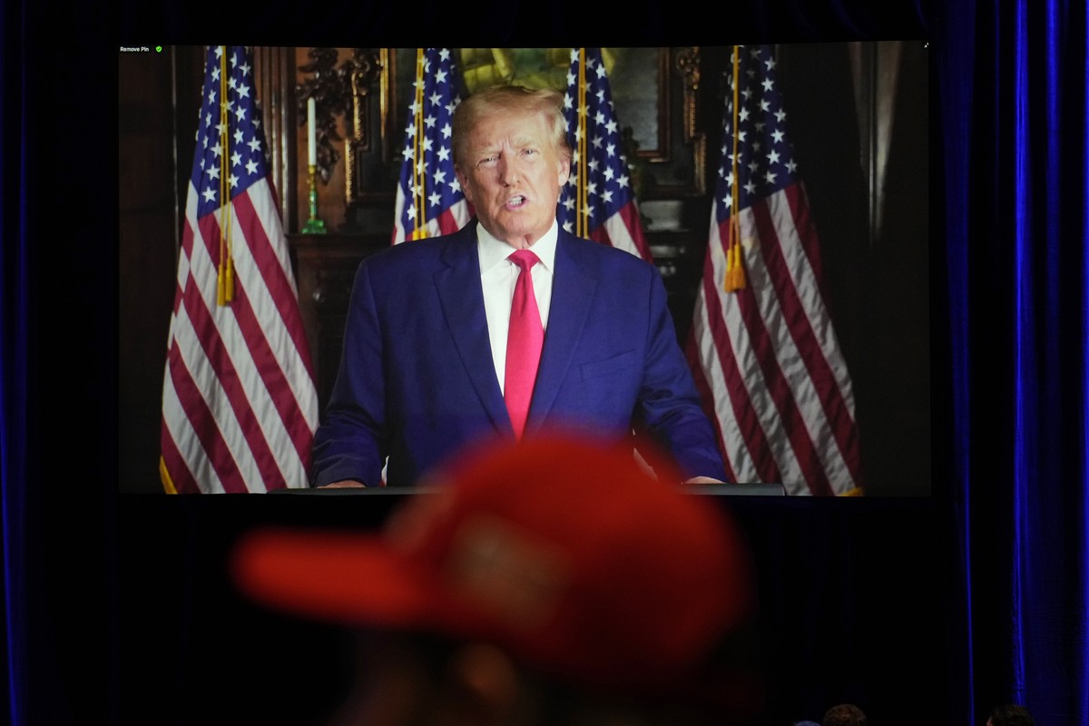 People listen as former President Donald Trump speaks remotely to an annual leadership meeting of the Republican Jewish Coalition Saturday, Nov. 19, 2022, in Las Vegas. (AP Photo/John Locher)