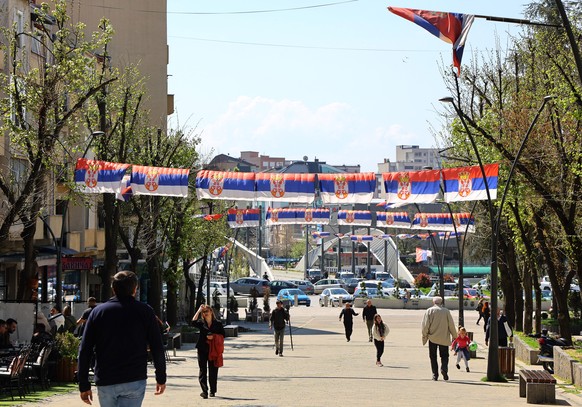 epa10587366 Serbian flags decorate a street in Northern Mitrovica, Kosovo, 23 April 2023. Four Serb-majority municipalities in northern Kosovo are holding elections for mayors and municipal institutio ...
