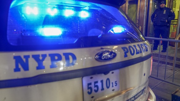 A New York City Police car and a court officer stand guard outside the Manhattan District attorney&#039;s office , Thursday, March 30, 2023, in New York. (AP Photo/Mary Altaffer)