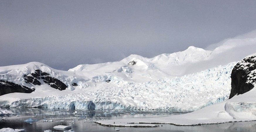 In this Dec. 7, 2018, photo provided by Wayne Dunn, tourists hike on an island on the Western Peninsula of Antarctica. Forty educators participated in the 2018 class of Grosvenor Teacher Fellows, a pr ...