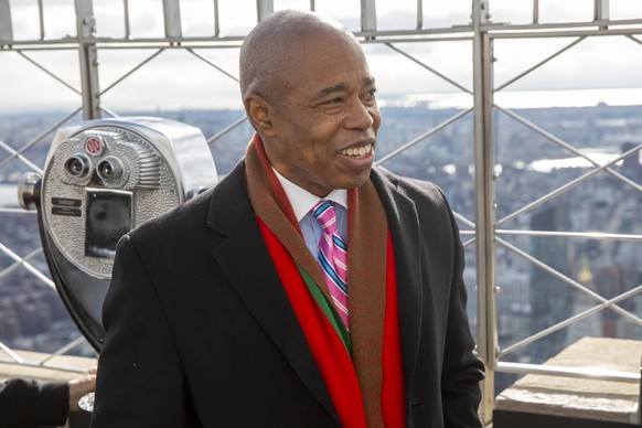 epa09693748 New York City Mayor Eric Adams views the city from the 86th floor of the Empire State Building during the launch of NYC &amp; Company?s NYC Winter Outing Program in New York, New York, USA ...