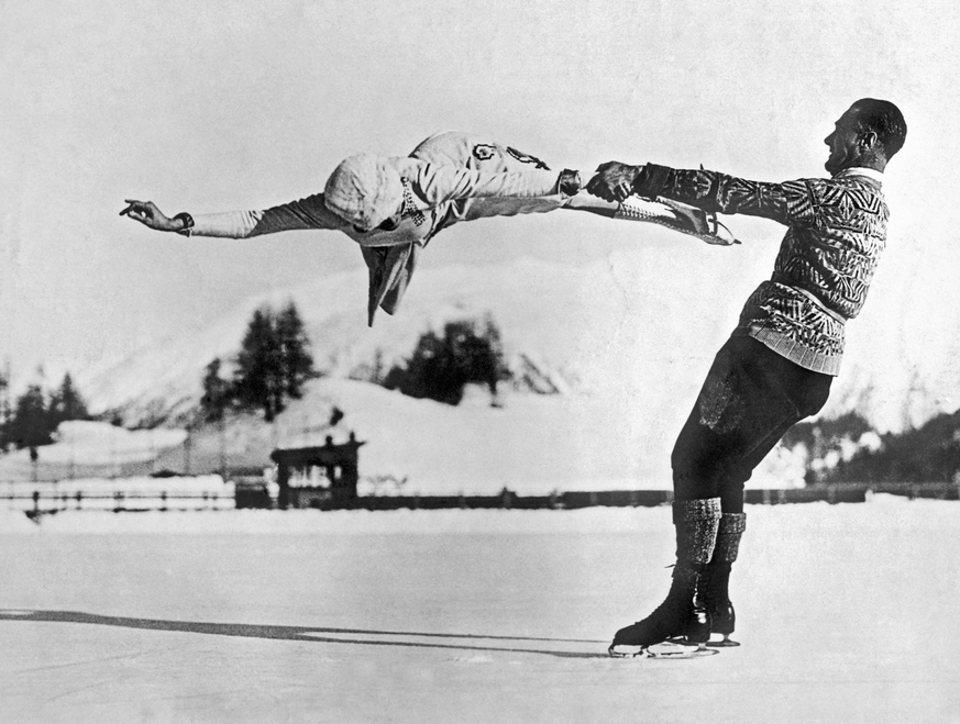 St. Moritz, Switzerland: c. 1935. World-renowned New York figure skaters Freda Whitaker and Phil Taylor show some amazing acrobatics as they prepare for the next Winter Olympics.