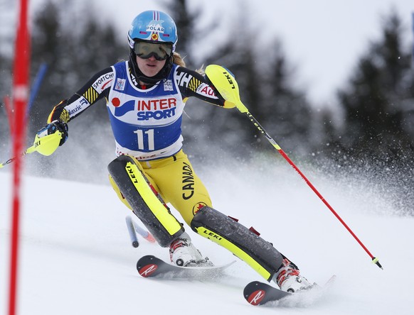 Canada's Erin Mielzynski skies past a pole during the first run of an alpine ski, women's World Cup slalom, in Santa Caterina, Italy, Tuesday, Jan. 5, 2016. (AP Photo/Alessandro Trovati)