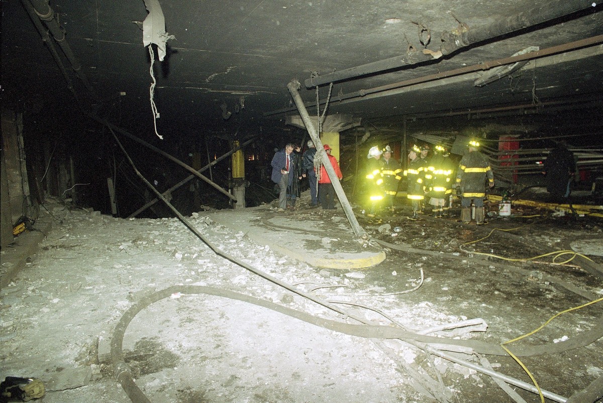 Firemen and officials examine the underground parking garage after a massive explosion in the World Trade Center in New York City on Friday, Feb. 26, 1993. The trial to determine whether the Port Auth ...