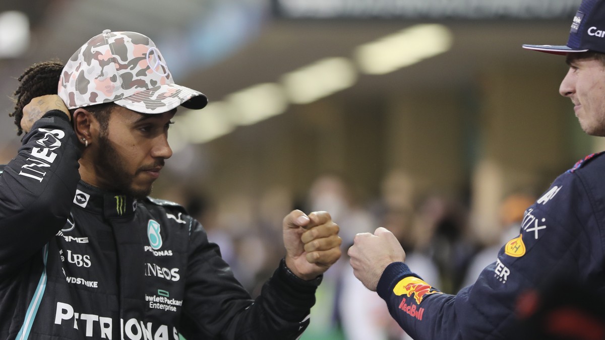 Mercedes driver Lewis Hamilton of Britain bumps fists with Red Bull driver Max Verstappen of the Netherlands after qualifying session for the Formula One Abu Dhabi Grand Prix in Abu Dhabi, United Arab ...