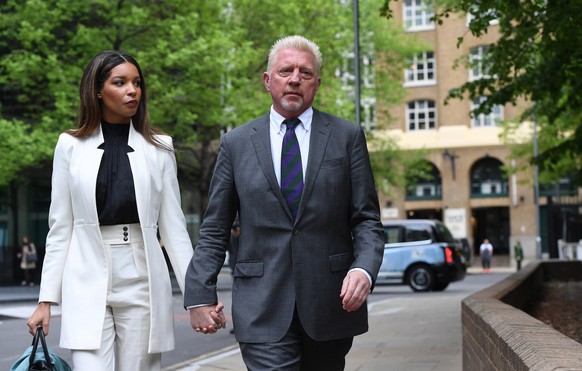 epa09916241 Former tennis champion Boris Becker (R) arrives at Southwark Crown Court with his partner Lilian de Carvalho in London, Britain, 29 April 2022. Becker is due to be sentenced in his bankrup ...