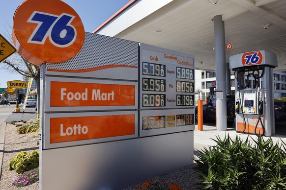 epa12831454 Digital price signs are seen at a 76 gasoline station in Emeryville, California, USA, 18 March 2026. Crude oil prices have surged since US and Israeli military strikes against Iran last mo ...