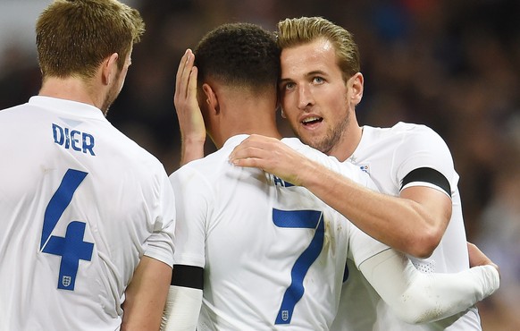 epa05030246 England&#039;s Tottenham team mates Dele Alli is congratulated by Harry Kane (R) and Eric Dier (L) after scoring against France during an international soccer friendly match at Wembley Sta ...