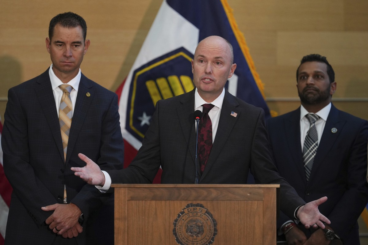 Utah Gov. Spencer Cox speaks at a news conference, as Utah department of public safety commissioner Beau Mason, left, and FBI Director Kash Patel listens, Friday, Sept. 12, 2025, in Orem, Utah,(AP Pho ...