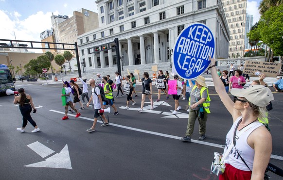epa10062437 Abortion right activists protest in front of the Miami-Dade County Courthouse, in Miami, Florida, USA 09 July 2022. On 24 June the US Supreme Court issued a ruling on Dobbs v Jackson Women ...