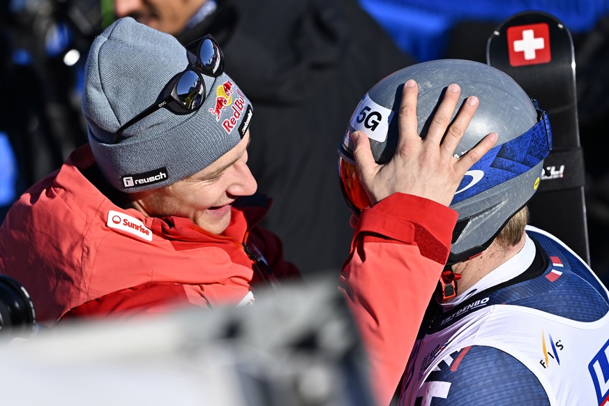 epa10462719 Marco Odermatt of Switzerland, left, and Aleksander Aamodt Kilde of Norway react in the finish area during the men&#039;s downhill race at the 2023 FIS Alpine Skiing World Championships in ...