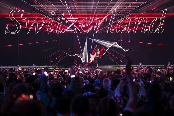 Switzerland&#039;s Zoe Me takes part in the flag parade during the final at the 69th Eurovision Song Contest in Basel, Switzerland, on Saturday, May 17, 2025. (KEYSTONE/Georgios Kefalas)