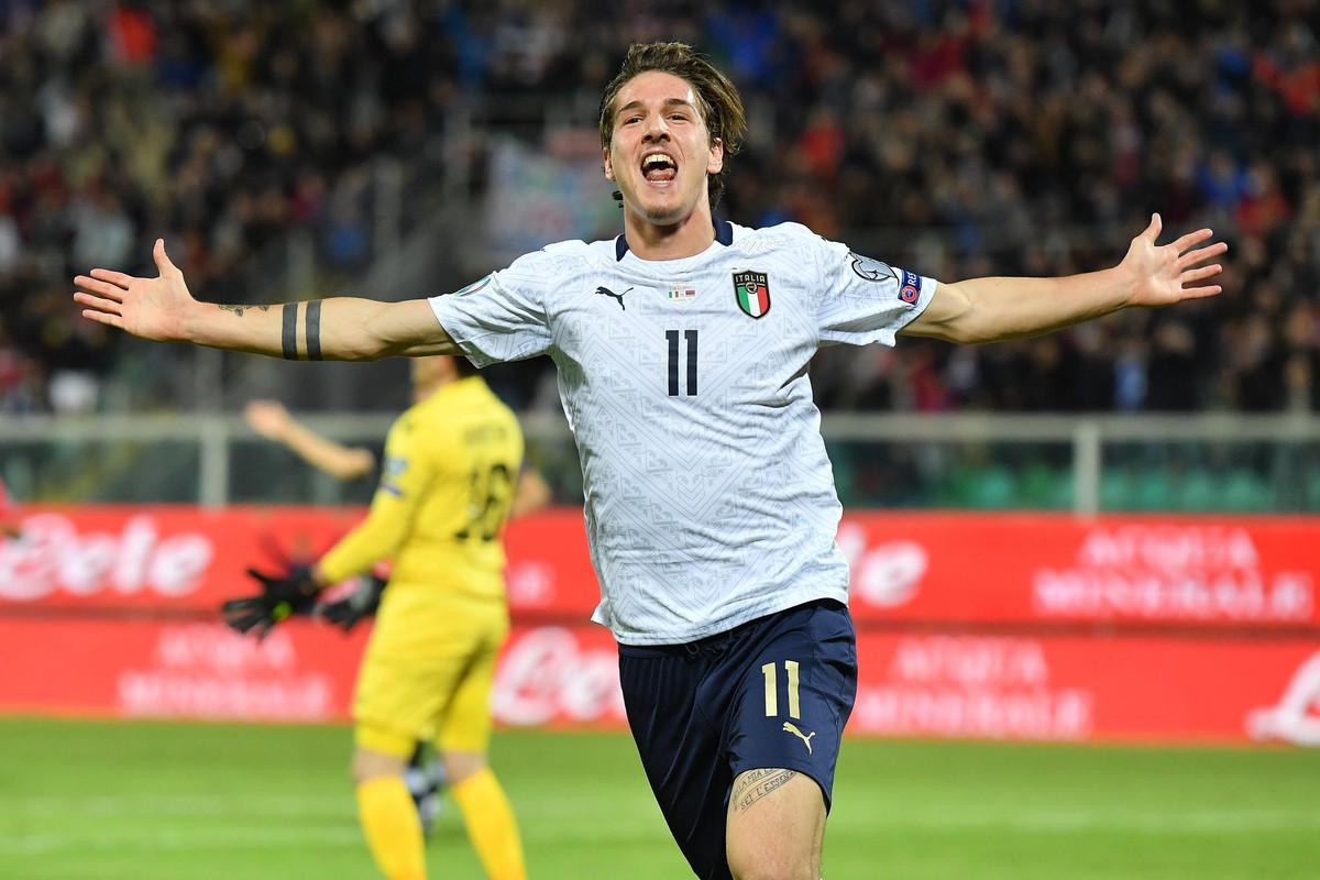 Italy's Nicolo' Zaniolo celebrates after scoring his side's second goal during a group J qualifying soccer match between Italy and Armenia at the Renzo Barbera stadium, in Palermo, Ital ...