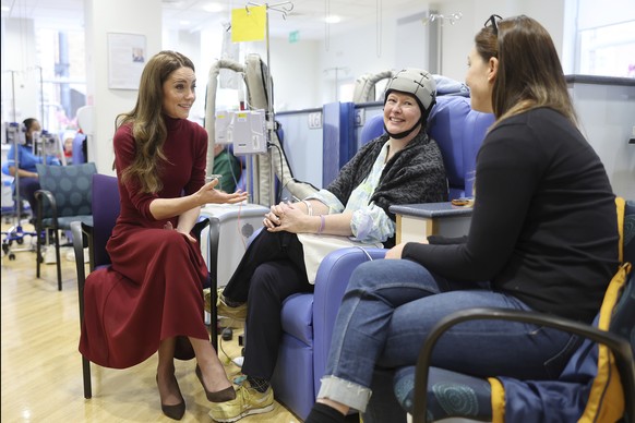 Britain&#039;s Princess Kate, center, alks with Katherine Field, center, during a visit to The Royal Marsden Hospital, London, where she received her cancer treatment, Tuesday Jan. 14, 2025. (Chris Ja ...