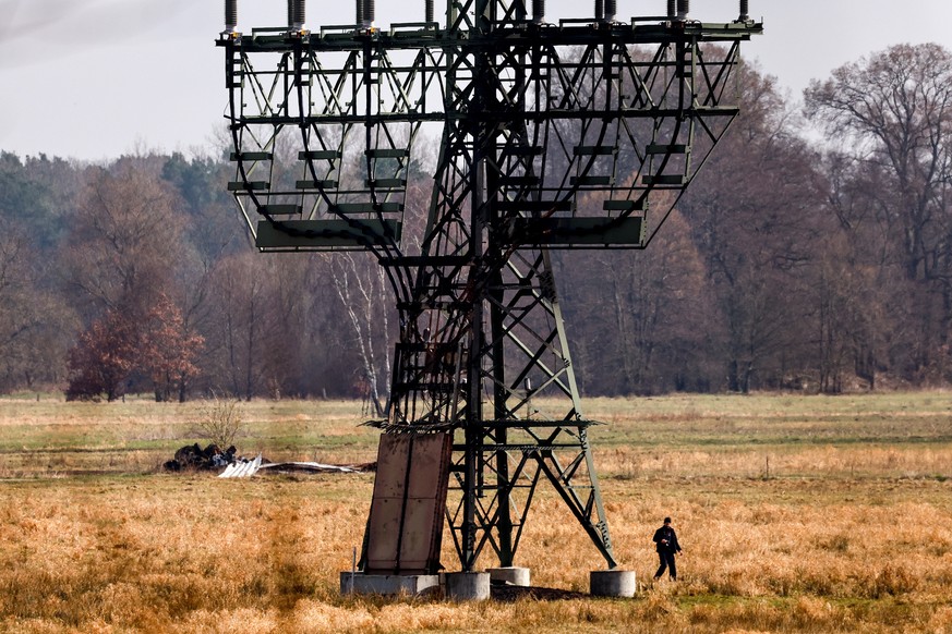 epa11199840 A view of a damaged electricity pylon near the Tesla Gigafactory in Gruenheide near Berlin, Germany, March 5, 2024. Tesla confirms that production at the Tesla Gigafactory in Gruenheide ...