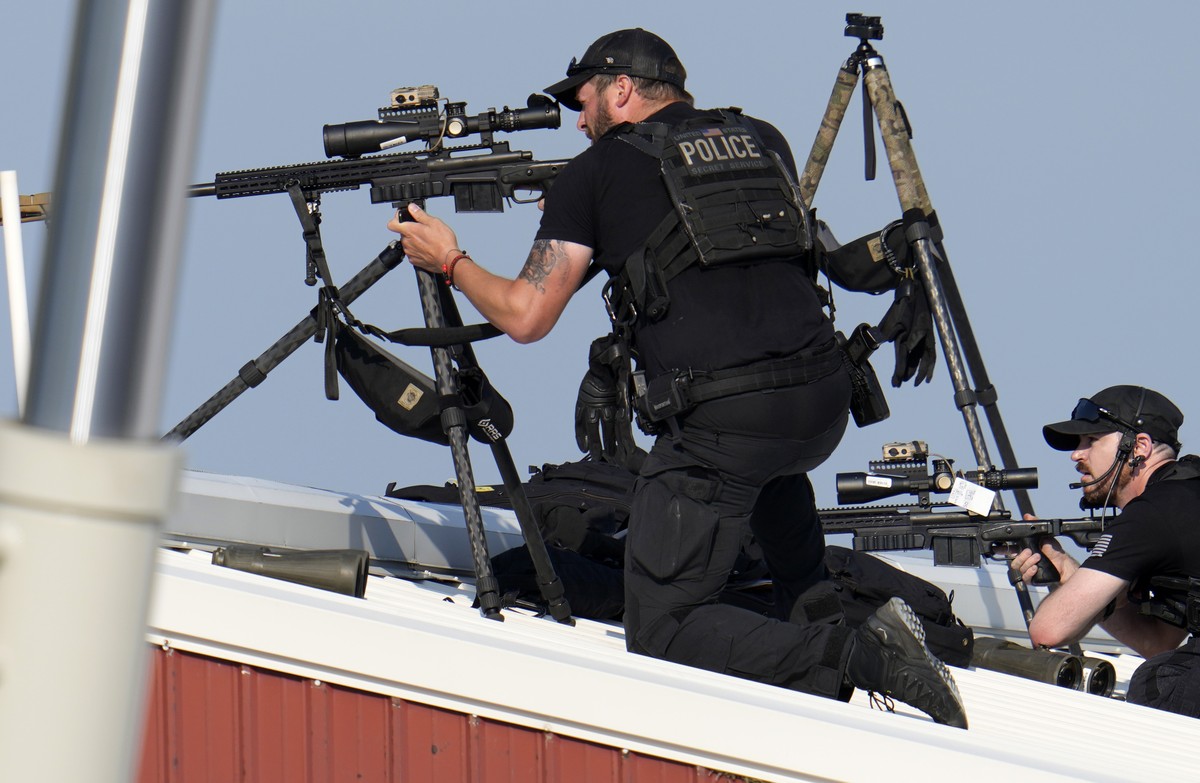 Police snipers return fire after shots were fired while Republican presidential candidate former President Donald Trump was speaking at a campaign event in Butler, Pa., on Saturday, July 13, 2024. (AP ...