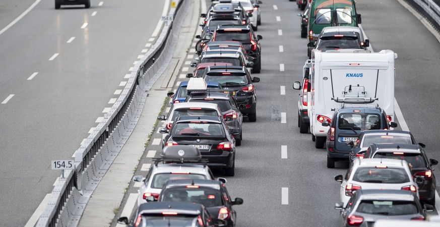 A traffic jam in Erstfeld, Switzerland, in front of the Gotthard tunnel with a length up to 14 kilometres, on Saturday, 14 July 2018. The summer holidays begin this weekend throughout Switzerland and  ...