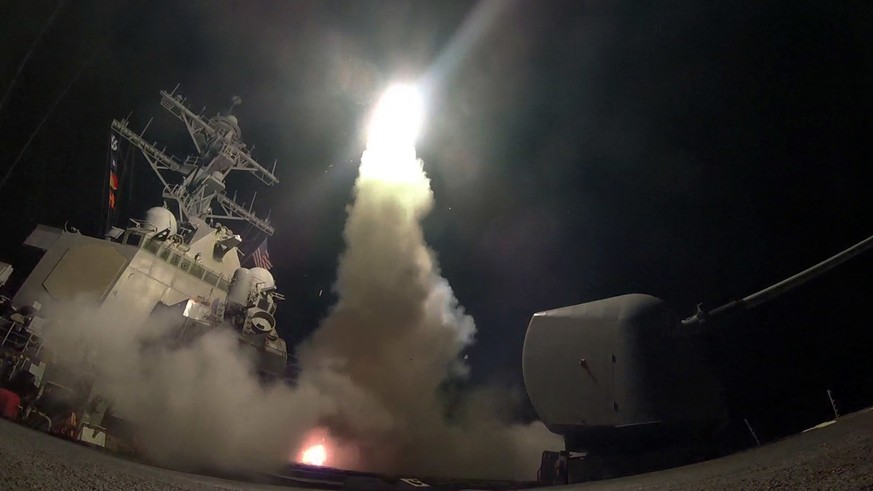 In this image provided by the U.S. Navy, the guided-missile destroyer USS Porter (DDG 78) launches a tomahawk land attack missile in the Mediterranean Sea, Friday, April 7, 2017. President Donald Trum ...