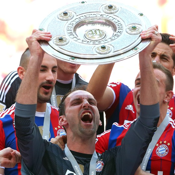 MUNICH, GERMANY - MAY 10: Tom Starke of Bayern Muenchen lifts the Bundesliga championship trophy in celebration after the Bundesliga match between Bayern Muenchen and VfB Stuttgart at Allianz Arena on ...