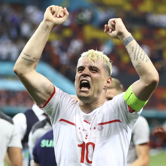 Switzerland&#039;s Granit Xhaka celebrates end of the Euro 2020 soccer championship round of 16 match between France and Switzerland at the National Arena stadium, in Bucharest, Romania, Tuesday, June ...