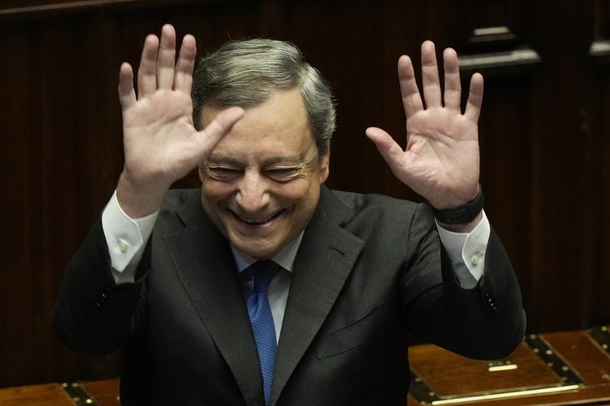 Italian Premier Mario Draghi waves to lawmakers at the end of his address at the Parliament in Rome, Thursday, July 21, 2022. Premier Mario Draghi&#039;s national unity government headed for collapse  ...