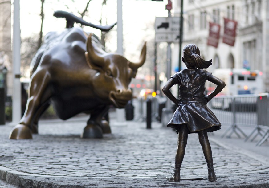 In this March 22, 2017 photo, the Charging Bull and Fearless Girl statues are sit on Lower Broadway in New York. Since 1989 the bronze bull has stood in New York City&#039;s financial district as an i ...