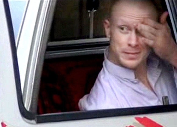 FILE - In this file image taken from video obtained from Voice Of Jihad Website, which has been authenticated based on its contents and other AP reporting, Sgt. Bowe Bergdahl, sits in a vehicle guarded by the Taliban in eastern Afghanistan. Once released from captivity, a soldier like Sgt. Bowe Bergdahl enters a series of debriefings and counseling sessions, all carefully orchestrated by the U.S. military, to ease the soldier back into normal life. In military parlance, it’s known as “reintegration,” and Bergdahl, who spent five years as a captive of the Taliban under circumstances now hotly debated, is working his way through its early stages at a U.S. military hospital in Germany. (AP Photo/Voice Of Jihad Website via AP video, File)