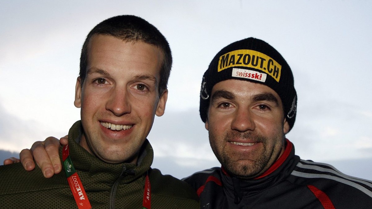 Swiss Racer Didier Defago, right, poses with his brother Daniel Defago on the sidelines of the Ski World Championship in Are, Sweden, Monday, February 5, 2007. Due to snow and wind the man's Supe ...