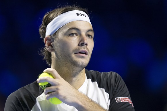 epa12473285 Taylor Fritz of the US in action against Monaco&#039;s Valentin Vacherot during their first round match at the Swiss Indoors tennis tournament in Basel, Switzerland, 22 October 2025. EPA/G ...