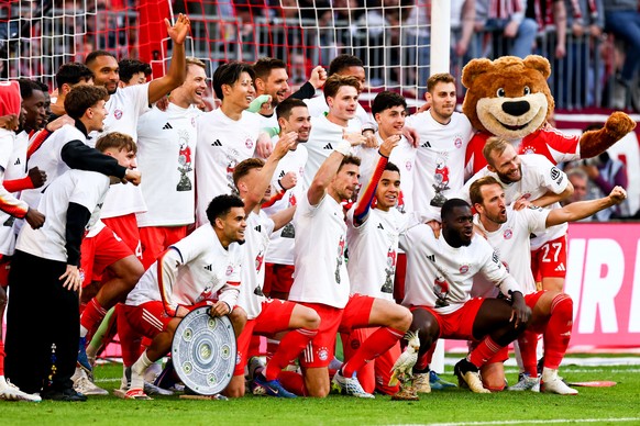 epa12900864 Munich's players celebrate winning the German league title following the German Bundesliga soccer match between FC Bayern Munich and VfB Stuttgart, in Munich, Germany, 19 April 2026.  ...