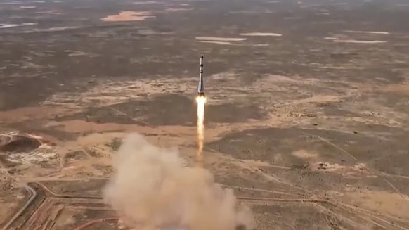 In this photo taken from video released by Roscosmos space corporation, the Soyuz-2.1a rocket booster with Progress MS-27 space cargo ship lifts off from the launch pad at the Russian leased Baikonur  ...