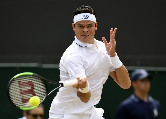 epa06075785 Milos Raonic of Canada returns to Albert Ramos-Vinolas of Spain in their third round match during the Wimbledon Championships at the All England Lawn Tennis Club, in London, Britain, 08 Ju ...