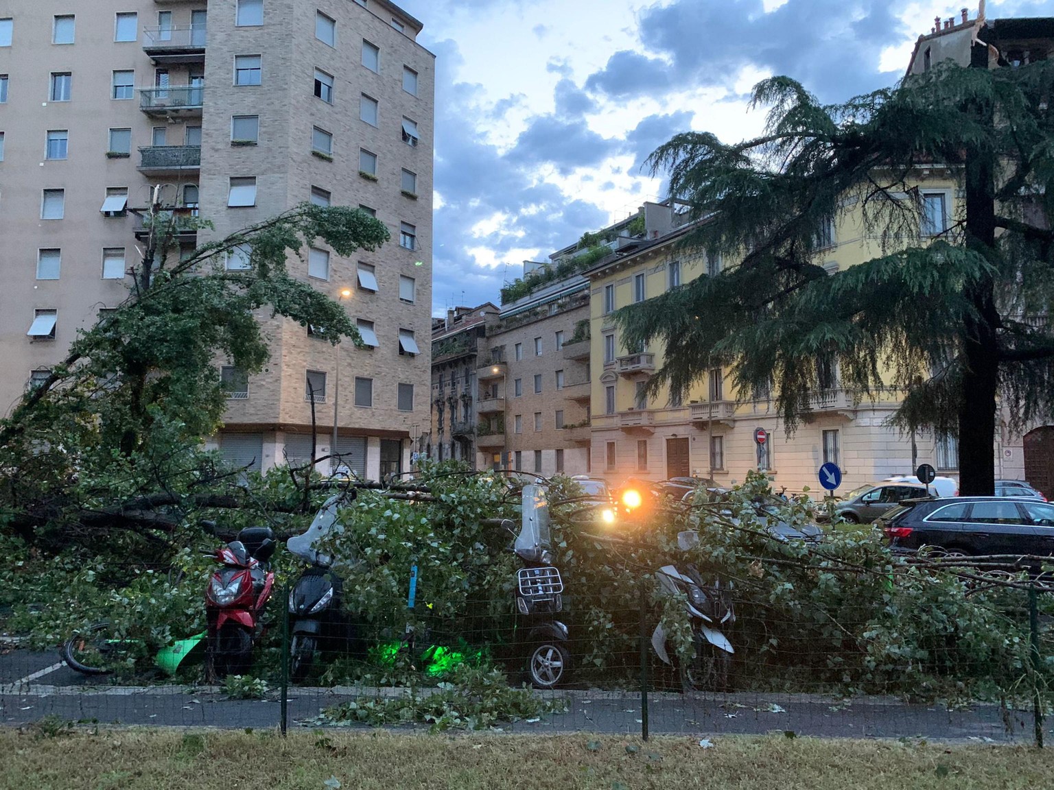 epa10767079 The aftermath of a storm which was accompanied by continuous discharges of lightning and sudden gusts of wind, in Milan, Italy, 25 July 2023. EPA/Luca Pinardi