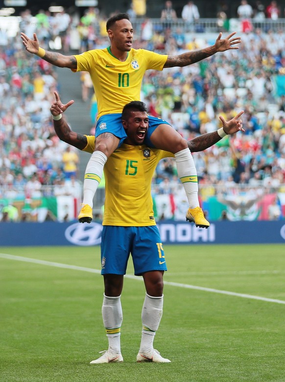 epa06858258 Neymar (top) of Brazil celebrates with teammate Paulinho after scoring the 1-0 during the FIFA World Cup 2018 round of 16 soccer match between Brazil and Mexico in Samara, Russia, 02 July  ...