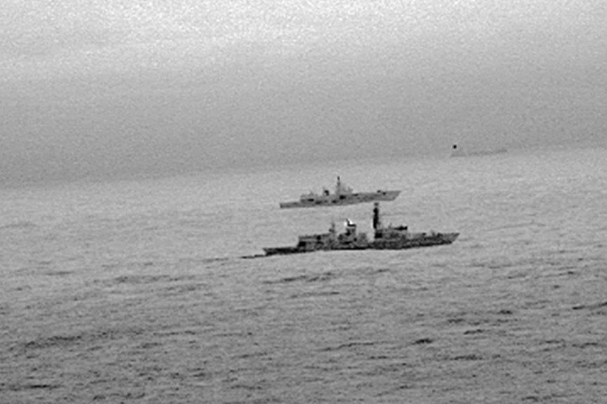 epa06405843 A handout photo made available by the British Ministry of Defence (MOD) on 26 December 2017 shows Britain&#039;s Royal Navy frigate HMS St Albans escorting a Russian warship through the No ...