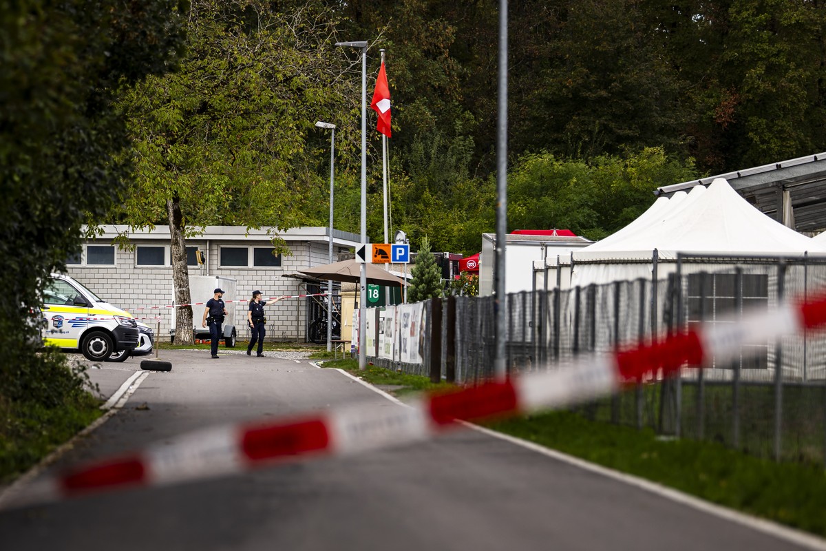 epa13201954 Police officers stand guard at the Schachen horse racing track, the site of a deadly rave party shooting incident, in Aarau, Switzerland, 31 August 2026. One person was killed, and five ot ...