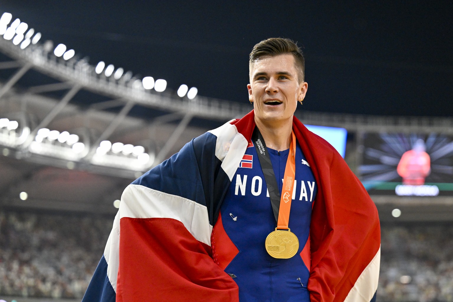 Jakob Ingebrigtsen, of Norway celebrates after winning the gold medal in the final of the Men&#039;s 5000-meters during the World Athletics Championships in Budapest, Hungary, Sunday, Aug. 27, 2023. ( ...