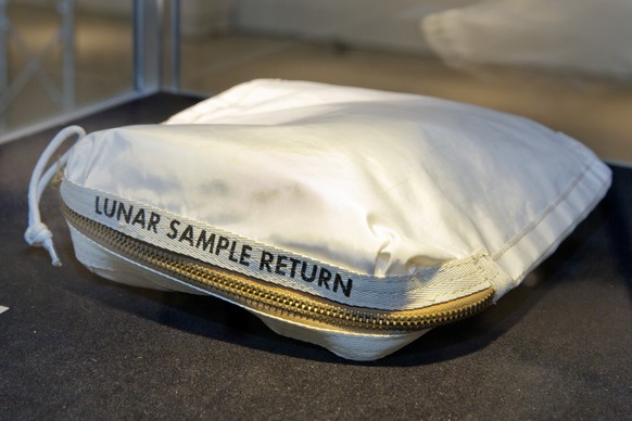 The Apollo 11 Contingency Lunar Sample Return Bag used by astronaut Neil Armstrong, to be offered at auction, is displayed at Sotheby&#039;s, in New York, Thursday, July 13, 2017. The lunar dust plus  ...