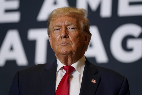 FILE - Former President Donald Trump arrives at a commit to caucus rally, Saturday, Oct. 7, 2023, in Cedar Rapids, Iowa. Federal prosecutors and lawyers for Donald Trump will argue in court Monday, Oc ...